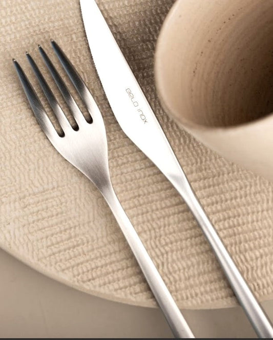 Obelisko 24 piece stainless steel cutlery set by Belo Inox on neutral modern table