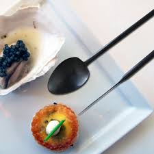 Herdmar Stick Matte Black cutlery – modern 18/10 stainless steel spoon and fork in matte finish, styled with a gourmet dish on a white plate.