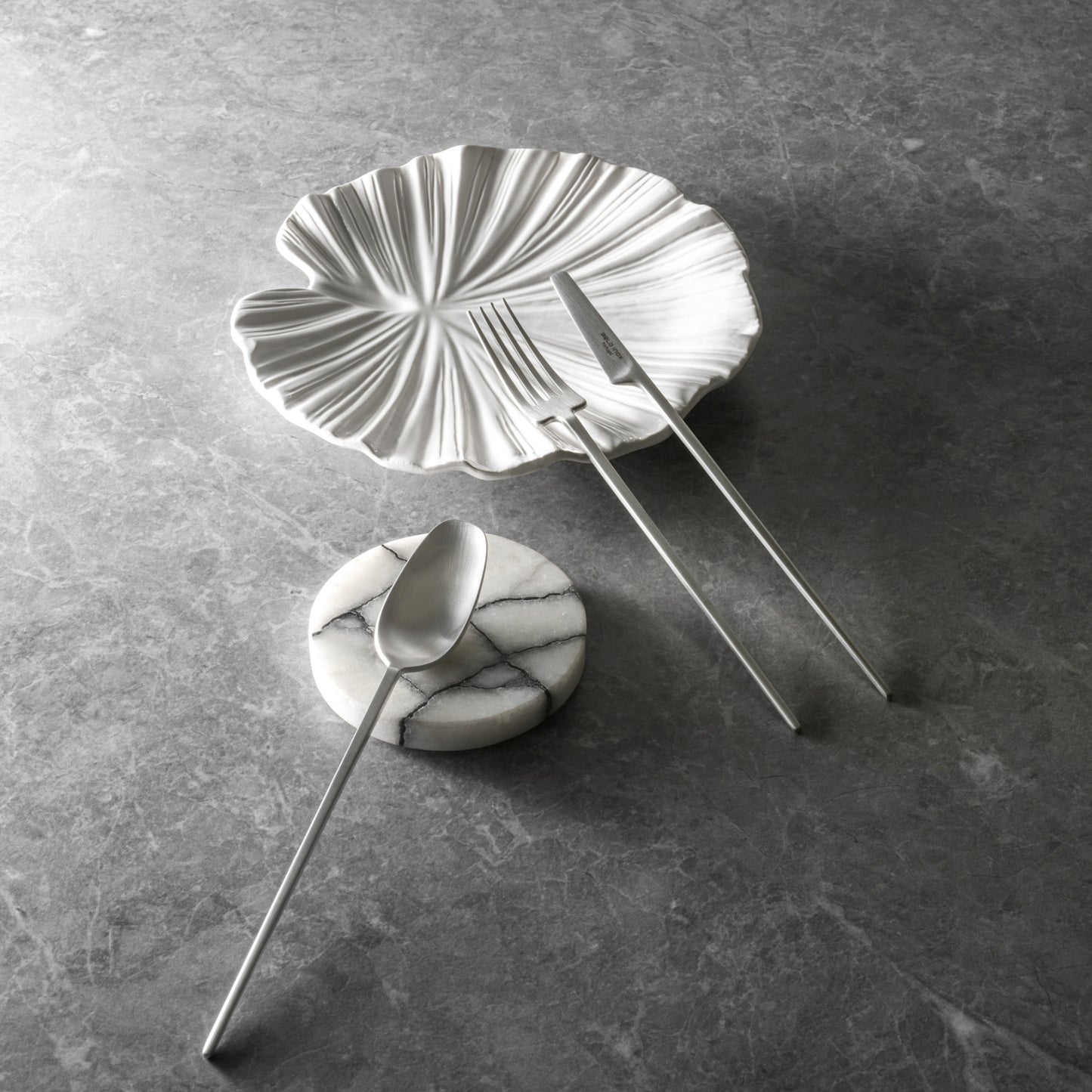 Belo Inox Two titanium matte cutlery set styled on marble plate – premium Portuguese flatware