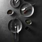 Modern table setting featuring Belo Inox Yume cutlery in brushed steel with black handles