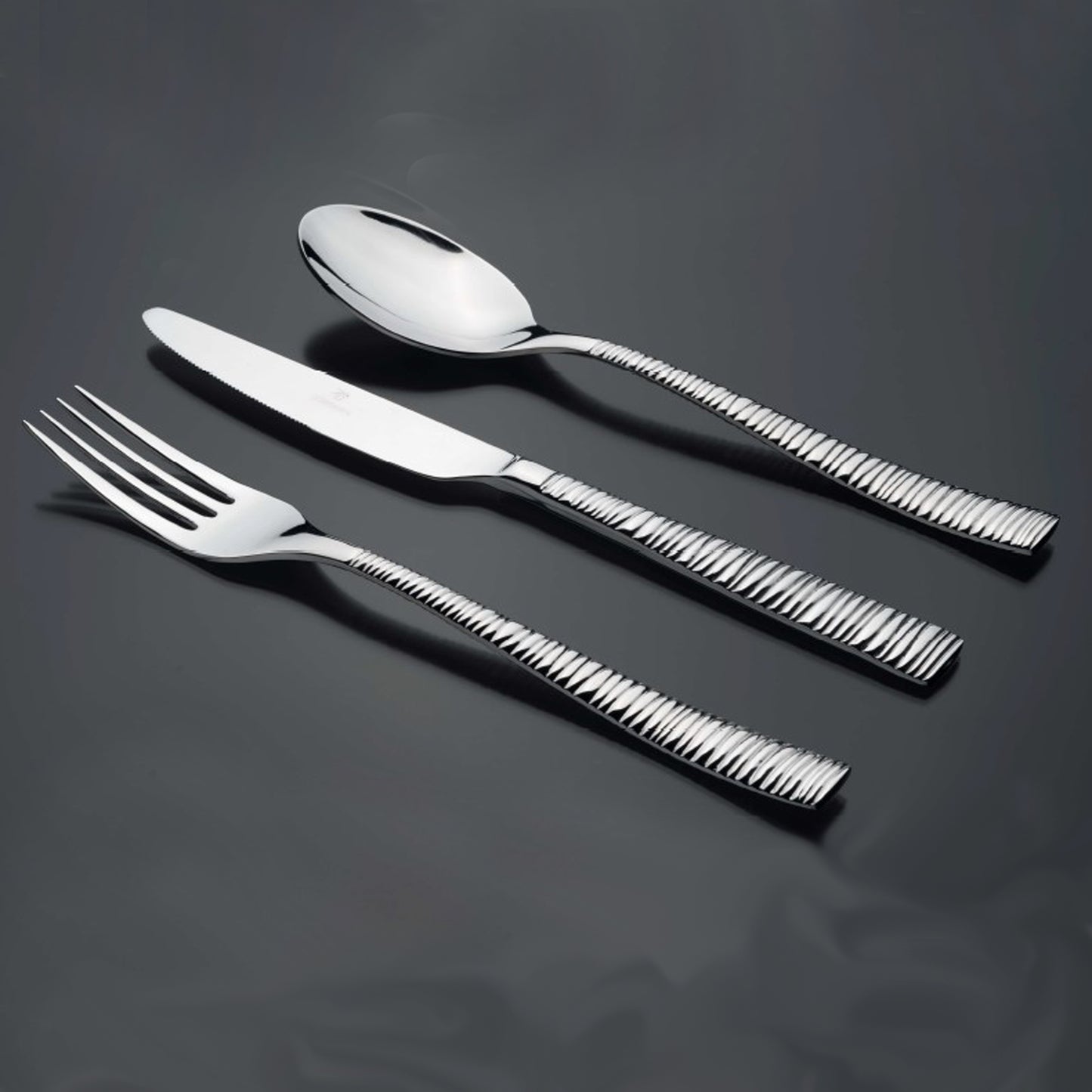Bright Kitchen Rhythm Cutlery Set in polished stainless steel with textured handles
