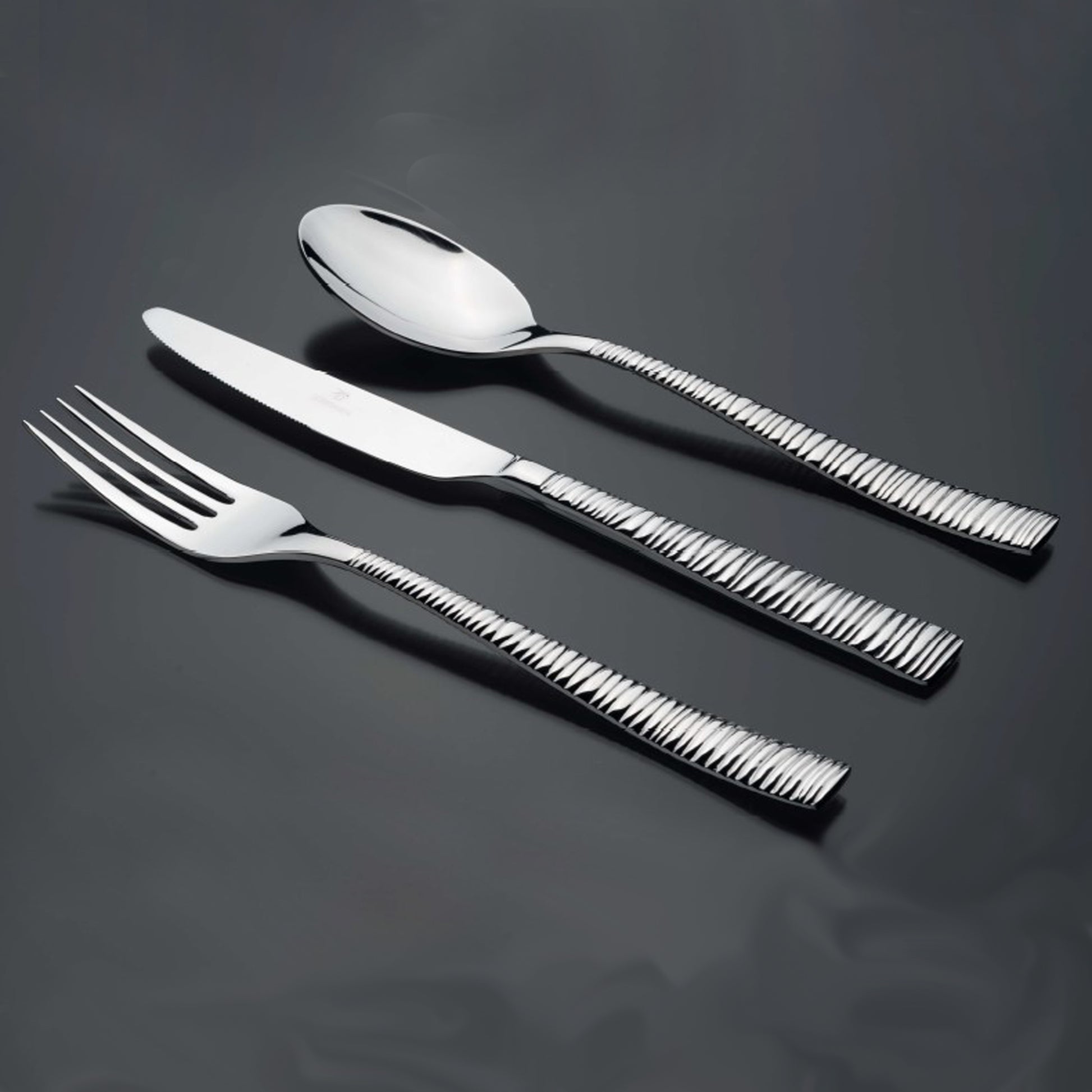 Bright Kitchen Rhythm Cutlery Set in polished stainless steel with textured handles
