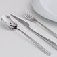 Cutipol Icon cutlery set in polished stainless steel with table fork, table knife and table spoon displayed on a white surface.
