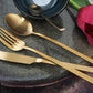 Elegant table setting with Herdmar Arco Gold PVD Cutlery Set – matte gold 18/10 stainless steel flatware, modern design, made in Portugal