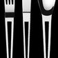 Herdmar Aztek cutlery set with knife, fork, and spoon in polished stainless steel on a black background.