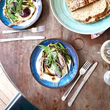 Herdmar Oslo Cutlery Set – Scandinavian-inspired stainless steel flatware on a rustic wooden table, elegant and minimalist, made in Portugal