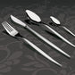 Herdmar Tiffany 18/10 stainless steel cutlery set – fork, knife, and spoons with mirror-polished finish displayed on an elegant dark floral background.