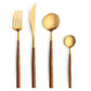 Belo Inox Neo Brown Gold cutlery set with golden heads and brown resin handles, displayed on a white background.
