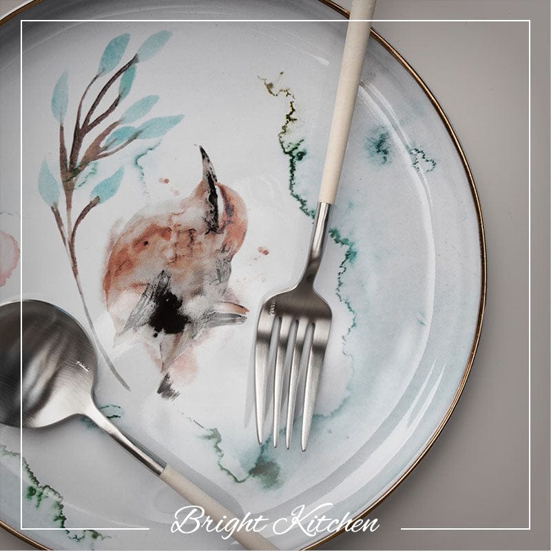 Elegant table setting featuring Belo Inox Neo Ivory cutlery with stainless steel and ivory resin handles, styled on a ceramic plate. Bright Kitchen exclusive