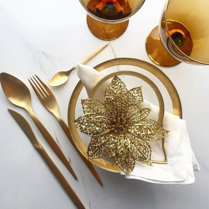 Elegant table setting featuring the Herdmar Tiffany PVD Gold Matte Cutlery Set – matte gold finish flatware arranged with golden plates and glassware